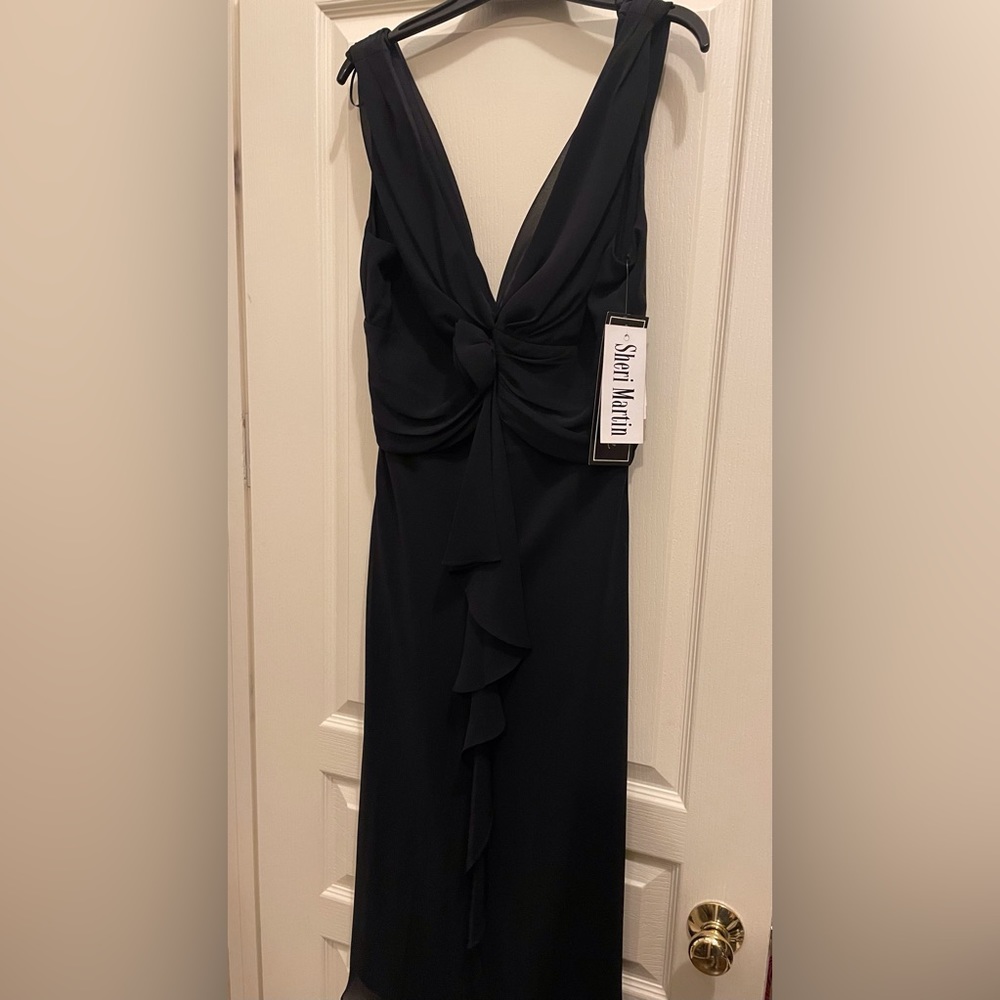 New with tag black v-neck and back  dress.